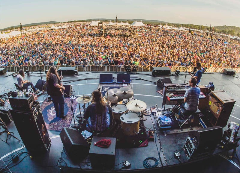 Hard Working Americans on stage in front of a festival crowd